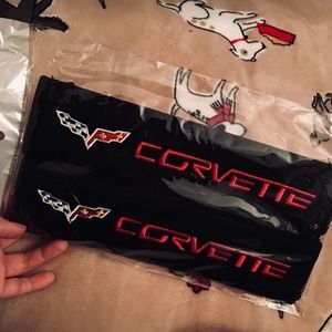 Two new Corvette seat belt pads black and red.  Other Corvette accessories avail